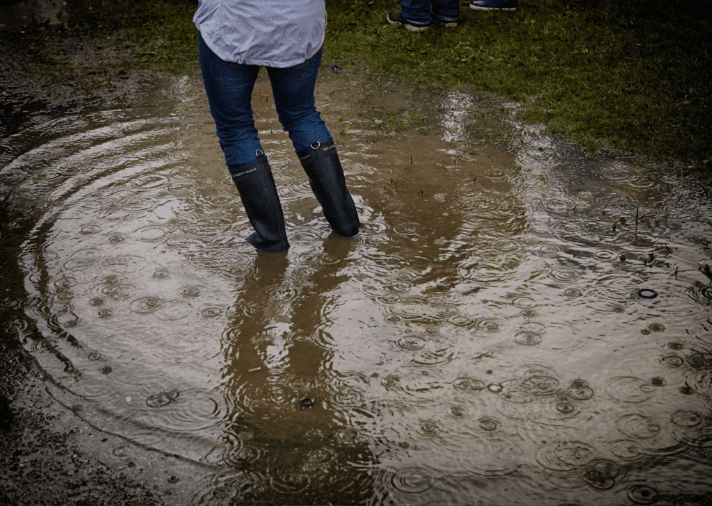 girl wearing jeans in a muddy