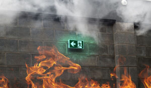 A Burning Fire Extinguisher In Front Of A Building, Disaster Restoration Experts, Prevent Smoke Damage
